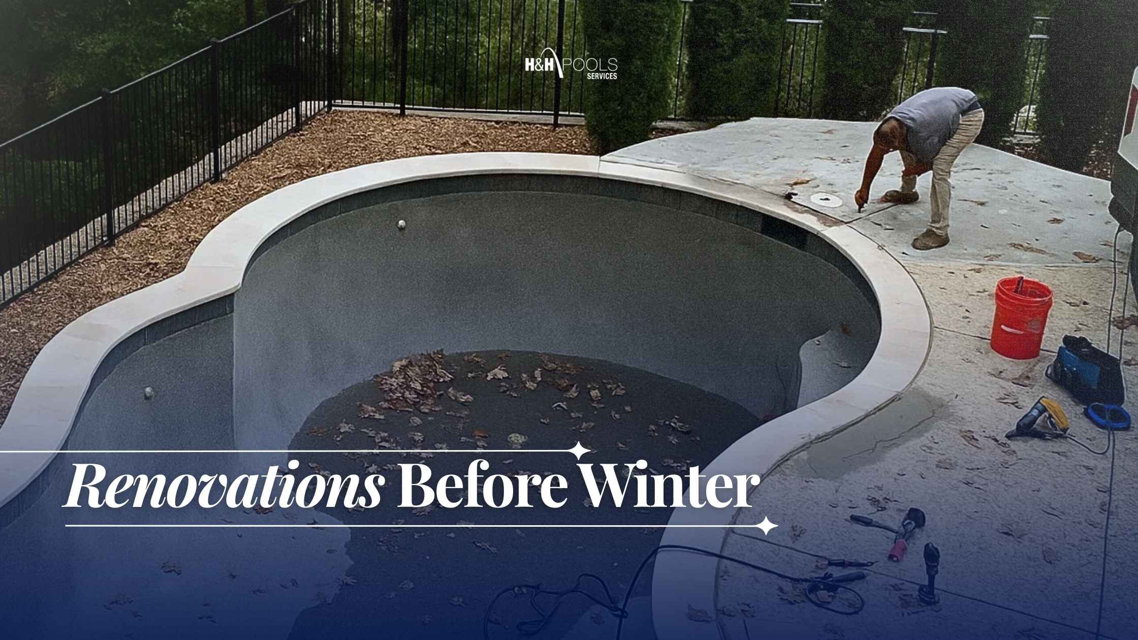 H&H_October 2025_blog1_How to winterize a pool renovations before winter Worker performing renovations on an empty pool surrounded by autumn leaves, with tools and equipment on the deck.